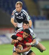 23 September 2011; Doug Howlett, Munster, is tackled just short of the line by Ceri Sweeney and Dan Fish, Cardiff Blues. Celtic League, Cardiff Blues v Munster, Cardiff City Stadium, Cardiff, Wales. Picture credit: Steve Pope / SPORTSFILE