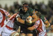 23 September 2011; John Muldoon, Connacht, is tackled by Rob Sidoli, left, and Lewis Evans, Dragons. Celtic League, Connacht v Newport Gwent Dragons, Sportsground, Galway. Picture credit: Diarmuid Greene / SPORTSFILE