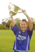 24 September 2011; Ballymacarbry, Waterford, captain Linda Wall lifts the Senior Championship trophy after victory over Banner Ladies, Clare, during the Tesco All-Ireland Ladies Football Club Sevens. Naomh Mearnóg GAA Club, Portmarnock, Co. Dublin Picture credit: Pat Murphy / SPORTSFILE