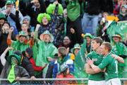 25 September 2011; Irish supporters celebrate as Andrew Trimble congratulates Keith Earls on scoring his first, and Ireland's fourth, try of the game. 2011 Rugby World Cup, Pool C, Ireland v Russia, Rotorua International Stadium, Rotorua, New Zealand. Picture credit: Brendan Moran / SPORTSFILE