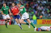 25 September 2011; Keith Earls, Ireland, slips through the tackle of Artem Fatakhov, Russia, on the way to scoring his second and his side's 6th try. 2011 Rugby World Cup, Pool C, Ireland v Russia, Rotorua International Stadium, Rotorua, New Zealand. Picture credit: Brendan Moran / SPORTSFILE