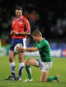 25 September 2011; Ireland out-half Ronan O'Gara shares a light-hearted moment with referee Craig Joubert as he prepares to convert a try by Rob Kearney. The kick was successful and made O'Gara Ireland's leading points scorer in Rugby World Cup matches with 72 points ahead of David Humphreys, who previously held the highest total with 70 points. 2011 Rugby World Cup, Pool C, Ireland v Russia, Rotorua International Stadium, Rotorua, New Zealand. Picture credit: Brendan Moran / SPORTSFILE