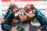 25 September 2011; Dan Tuohy, Ulster, is tackled by Hanno Dirksen, left, and Dan Biggar, Ospreys. Celtic League, Ospreys v Ulster, Liberty Stadium, Swansea, Wales. Picture credit: Steve Pope / SPORTSFILE