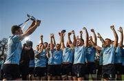 7 April 2017; UCD captain Jamie Glynn celebrates with the trophy and team mates following their side's victory in the 65th Annual Colours Match between University College Dublin and Dublin University FC at the Belfield Bowl in UCD, Co. Dublin. Photo by David Fitzgerald/Sportsfile