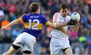 8 April 2017; Pauric Smith of Louth is tackled by Brian Fox of Tipperary during the Allianz Football League Division 3 Final match between Louth and Tipperary at Croke Park in Dublin. Photo by Brendan Moran/Sportsfile