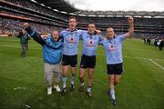 18 September 2011; Dublin players, from left, Kevin Nolan, Paul Casey and Paul Conlon celebrate victory after the game with supporter Stephen Molloy. GAA Football All-Ireland Senior Championship Final, Kerry v Dublin, Croke Park, Dublin. Picture credit: Stephen McCarthy / SPORTSFILE