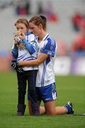 25 September 2011; Monaghan's Amanda Casey with her daughter Emma Casey, aged 7, after defeat against Cork. TG4 All-Ireland Ladies Senior Football Championship Final, Cork v Monaghan, Croke Park, Dublin. Picture credit: Pat Murphy / SPORTSFILE