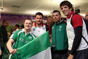 26 September 2011; Ireland's, from left, Fergus McFadden, Denis Leamy and Donncha O'Callaghan pose for a photo with a fan on the team's arrival in Dunedin. Ireland Rugby Squad Arrival in Dunedin, New Zealand. Picture credit: Dianne Manson / SPORTSFILE