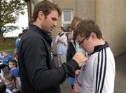 26 September 2011; Dublin captain Bryan Cullen signs the shirt of Enda Fitzpatrick during his visit to St Michaels House Special National School. Golf Links Road, Hacketstown, Skerries, Dublin. Photo by Sportsfile