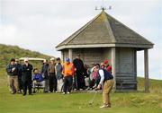 14 September 2011; Supporters watch on as Michael Lane Athenry Golf Club, Co. Galway, putts during the Barton Shield Semi-Final. Chartis Cups and Shields Finals 2011, Castlerock Golf Club, Co. Derry. Picture credit: Oliver McVeigh / SPORTSFILE