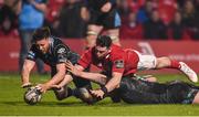 8 April 2017; Ali Price, left, and Jonny Gray of Glasgow Warriors manage to ground the bell to prevent  Ronan O'Mahony of Munster scoring a try during the Guinness PRO12 Round 19 match between Munster and Glasgow Warriors at Irish Independent Park in Cork. Photo by Matt Browne/Sportsfile