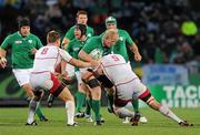 25 September 2011; Leo Cullen, Ireland, is tackled by Victor Gresev, left, and Adam Byrnes, Russia. 2011 Rugby World Cup, Pool C, Ireland v Russia, Rotorua International Stadium, Rotorua, New Zealand. Picture credit: Brendan Moran / SPORTSFILE