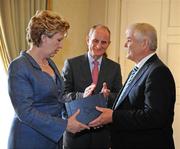 27 September 2011; Dublin County Board Chairman Andy Kettle makes a presentation to President Mary McAleese and her husband Senator Martin McAleese during the All-Ireland Football Champions visit to Áras an Uachtaráin, Phoenix Park, Dublin. Picture credit: Ray McManus / SPORTSFILE