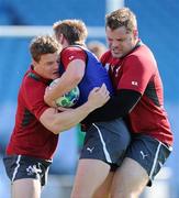 28 September 2011; Ireland Brian O'Driscoll and Mike Ross tackle Eoin Reddan during squad training ahead of their 2011 Rugby World Cup, Pool C, game against Italy on Sunday. Ireland Rugby Squad Training, Carisbrook Stadium, Dunedin, New Zealand. Picture credit: Brendan Moran / SPORTSFILE
