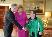 28 September 2011; Special Olympics athlete Joseph Cullen, from Strandill, Co. Sligo, with President Mary McAleese and her husband Senator Martin McAleese at a reception for the Special Olympics World Summer Games squad in Aras an Uachtarain, Phoenix Park, Dublin. Picture credit: Ray McManus / SPORTSFILE
