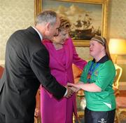28 September 2011; Special Olympics athlete Ciara O'Loughlin, from Inagh, Co. Clare, with President Mary McAleese and her husband Senator Martin McAleese at a reception for the Special Olympics World Summer Games squad in Aras an Uachtarain, Phoenix Park, Dublin. Picture credit: Ray McManus / SPORTSFILE