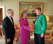 28 September 2011; Special Olympics athlete Jonathon Deering, from Dunlavin, Co. Wicklow, with President Mary McAleese and her husband Senator Martin McAleese at a reception for the Special Olympics World Summer Games squad in Aras an Uachtarain, Phoenix Park, Dublin. Picture credit: Ray McManus / SPORTSFILE