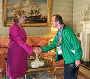 28 September 2011; Special Olympics athlete Adrian Cornwall, from Tonphubble, Co. Sligo, with President Mary McAleese at a reception for the Special Olympics World Summer Games squad in Aras an Uachtarain, Phoenix Park, Dublin. Picture credit: Ray McManus / SPORTSFILE