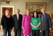 28 September 2011; Special Olympics athlete Laura Reynolds, from Kilbride, Co, Wicklow, and family members Patrick Roche, right, and Catherine Chappell, with President Mary McAleese and her husband Senator Martin McAleese at a reception for the Special Olympics World Summer Games squad in Aras an Uachtarain, Phoenix Park, Dublin. Picture credit: Ray McManus / SPORTSFILE