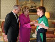 28 September 2011; Special Olympics athlete Paul Dalton, from Athlone, Co. Westmeath, with President Mary McAleese and her husband Senator Martin McAleese at a reception for the Special Olympics World Summer Games squad in Aras an Uachtarain, Phoenix Park, Dublin. Picture credit: Ray McManus / SPORTSFILE