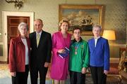 28 September 2011; Special Olympics athlete Mary Kirby, from Newcastle West, Co. Limerick, and her sisters Kitty O'Donovan, right, and Eileen Kirby, with President Mary McAleese and her husband Senator Martin McAleese at a reception for the Special Olympics World Summer Games squad in Aras an Uachtarain, Phoenix Park, Dublin. Picture credit: Ray McManus / SPORTSFILE