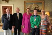 28 September 2011; Special Olympics athlete Simon Darragh, from Celbridge, Co. Kildare, and family members Nial Darragh, left, and Paula Darragh, with President Mary McAleese and her husband Senator Martin McAleese at a reception for the Special Olympics World Summer Games squad in Aras an Uachtarain, Phoenix Park, Dublin. Picture credit: Ray McManus / SPORTSFILE