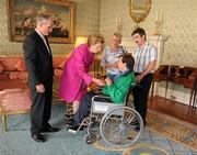 28 September 2011; Special Olympics athlete Mary Quigley, from Tullow, Co. Carlow, and family members Lillie Brown and John Cummins, with President Mary McAleese and her husband Senator Martin McAleese at a reception for the Special Olympics World Summer Games squad in Aras an Uachtarain, Phoenix Park, Dublin. Picture credit: Ray McManus / SPORTSFILE