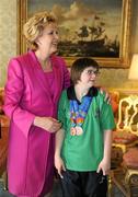 28 September 2011; Special Olympics athlete Laura Rumbell, from Dun Laoghaire, Co. Dublin, with President Mary McAleese at a reception for the Special Olympics World Summer Games squad in Aras an Uachtarain, Phoenix Park, Dublin. Picture credit: Ray McManus / SPORTSFILE