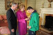 28 September 2011; Special Olympics athlete John Michael, from Cloghan, Co. Offaly, with President Mary McAleese and her husband Senator Martin McAleese at a reception for the Special Olympics World Summer Games squad in Aras an Uachtarain, Phoenix Park, Dublin. Picture credit: Ray McManus / SPORTSFILE