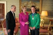 28 September 2011; Special Olympics athlete Conor MacGearailt, from Athy, Co. Kildare, with President Mary McAleese and her husband Senator Martin McAleese at a reception for the Special Olympics World Summer Games squad in Aras an Uachtarain, Phoenix Park, Dublin. Picture credit: Ray McManus / SPORTSFILE