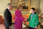 28 September 2011; Special Olympics athlete Mario McShane, from Barnesmore, Co. Donegal, with President Mary McAleese and her husband Senator Martin McAleese at a reception for the Special Olympics World Summer Games squad in Aras an Uachtarain, Phoenix Park, Dublin. Picture credit: Ray McManus / SPORTSFILE