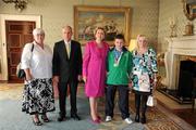 28 September 2011; Special Olympics athlete Mario McShane, from Barnesmore, Co. Donegal, and family members Celine McShane and Mary Mulligan, with President Mary McAleese and her husband Senator Martin McAleese at a reception for the Special Olympics World Summer Games squad in Aras an Uachtarain, Phoenix Park, Dublin. Picture credit: Ray McManus / SPORTSFILE