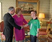 28 September 2011; Special Olympics athlete Stephen Deignan, from Blainroe, Co. Wicklow, with President Mary McAleese and her husband Senator Martin McAleese at a reception for the Special Olympics World Summer Games squad in Aras an Uachtarain, Phoenix Park, Dublin. Picture credit: Ray McManus / SPORTSFILE