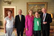 28 September 2011; Special Olympics athlete Stephen Deignan, from Blainroe, Co. Wicklow, and family members Paul Deignan, right, and Rita Deignan, with President Mary McAleese and her husband Senator Martin McAleese at a reception for the Special Olympics World Summer Games squad in Aras an Uachtarain, Phoenix Park, Dublin. Picture credit: Ray McManus / SPORTSFILE