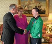 28 September 2011; Special Olympics athlete Shaun Bradley, from Letterkenny, Co. Donegal, with President Mary McAleese and her husband Senator Martin McAleese at a reception for the Special Olympics World Summer Games squad in Aras an Uachtarain, Phoenix Park, Dublin. Picture credit: Ray McManus / SPORTSFILE