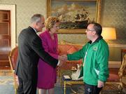 28 September 2011; Special Olympics athlete William Naughton, from Galbally, Co. Limerick with President Mary McAleese and her husband Senator Martin McAleese at a reception for the Special Olympics World Summer Games squad in Aras an Uachtarain, Phoenix Park, Dublin. Picture credit: Ray McManus / SPORTSFILE