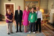28 September 2011; Special Olympics athlete William Naughton, from Galbally, Co. Limerick, and family members Liam Naughton, right, and Maureen Loughman, with President Mary McAleese and her husband Senator Martin McAleese at a reception for the Special Olympics World Summer Games squad in Aras an Uachtarain, Phoenix Park, Dublin. Picture credit: Ray McManus / SPORTSFILE
