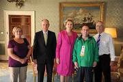 28 September 2011; Special Olympics athlete William Naughton, from Galbally, Co. Limerick, and family members Liam Naughton, right, and Maureen Loughman, with President Mary McAleese and her husband Senator Martin McAleese at a reception for the Special Olympics World Summer Games squad in Aras an Uachtarain, Phoenix Park, Dublin. Picture credit: Ray McManus / SPORTSFILE
