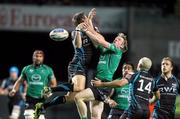 30 September 2011; Dan Biggar, Ospreys, contests a dropping ball with Eoin Griffin, Connacht. Celtic League, Ospreys v Connacht, Liberty Stadium, Swansea, Scotland. Picture credit: Steve Pope / SPORTSFILE
