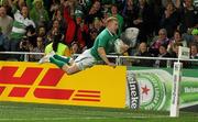 2 October 2011; Ireland's Keith Earls dives over the line to score his side's third try. 2011 Rugby World Cup, Pool C, Ireland v Italy, Otago Stadium, Dunedin, New Zealand. Picture credit: Tim Clayton / SPORTSFILE