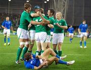 2 October 2011; Brian O' Driscoll, Ireland, is congratulated by his team-mates, from left, Donncha O'Callaghan, Jamie Heaslip, Rob Kearney and Keith Earls, after scoring his side's opening try, as Tommaso Benvenuti, Italy, lies on the ground after failing to make the tackle. 2011 Rugby World Cup, Pool C, Ireland v Italy, Otago Stadium, Dunedin, New Zealand. Picture credit: Tim Clayton / SPORTSFILE