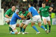 2 October 2011; Conor Murray, Ireland, is tackled by Cornelius van Zyl, left, and Alessandro Zanni, Italy. 2011 Rugby World Cup, Pool C, Ireland v Italy, Otago Stadium, Dunedin, New Zealand. Picture credit: Brendan Moran / SPORTSFILE