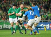 2 October 2011; Paul O'Connell, Ireland, is tackled by Quintin Geldenhuys and Andrea Lo Cicero, Italy. 2011 Rugby World Cup, Pool C, Ireland v Italy, Otago Stadium, Dunedin, New Zealand. Picture credit: Brendan Moran / SPORTSFILE