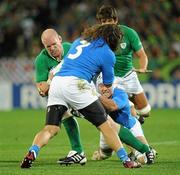 2 October 2011; Paul O'Connell, Ireland, is tackled by Cornelius van Zyl and Martin Castrogiovanni, 3, Italy. 2011 Rugby World Cup, Pool C, Ireland v Italy, Otago Stadium, Dunedin, New Zealand. Picture credit: Brendan Moran / SPORTSFILE