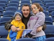 1 October 2011; Leinster supporters Josh Curran, aged 6, left, Alan Curran, centre, and Holly Curran, aged 9, all from Lucan, Dublin, at the game. Celtic League, Leinster v Aironi, RDS, Ballsbridge, Dublin. Picture credit: Diarmuid Greene / SPORTSFILE