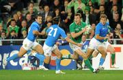 2 October 2011; Tommy Bowe, Ireland, breaks through the Italian defence on his way to setting up team-mate Brian O'Driscoll for their side's first try. 2011 Rugby World Cup, Pool C, Ireland v Italy, Otago Stadium, Dunedin, New Zealand. Picture credit: Brendan Moran / SPORTSFILE