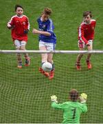 12 April 2017; Caolan O'Connor, representing St. Ronan's GAA Club, Co Roscommon, scores a goal despite the attempts of Shane O'Loughlin, left, Eoghan Healy, right, and goalkeeper Cillian O'Neill, representing Coolera Strandhill GAA Club, Co Sligo, during The Go Games Provincial Days in partnership with Littlewoods Ireland Day 3 at Croke Park in Dublin. Photo by Cody Glenn/Sportsfile