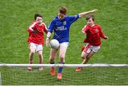 12 April 2017; Caolan O'Connor, representing St. Ronan's GAA Club, Co Roscommon, scores a goal despite the attempts of Shane O'Loughlin, left, and Eoghan Healy, representing Coolera Strandhill GAA Club, Co Sligo, during the The Go Games Provincial Days in partnership with Littlewoods Ireland Day 3 at Croke Park in Dublin. Photo by Cody Glenn/Sportsfile