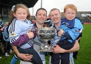 2 October 2011; Lucy Hartnett, aged 5, left, with her dad, Brian Hartnett, and captain Kieran Birmingham with his son Conor Birmingham, aged 3, celebrate with the cup after the game. Limerick County Senior Hurling Championship Final, Ahane v Na Piarsaigh, Pairc na nGael, Limerick. Picture credit: Diarmuid Greene / SPORTSFILE
