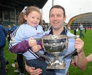 2 October 2011; Lucy Hartnett, aged 5, with her dad, Brian Hartnett, celebrate with the cup after the game. Limerick County Senior Hurling Championship Final, Ahane v Na Piarsaigh, Pairc na nGael, Limerick. Picture credit: Diarmuid Greene / SPORTSFILE